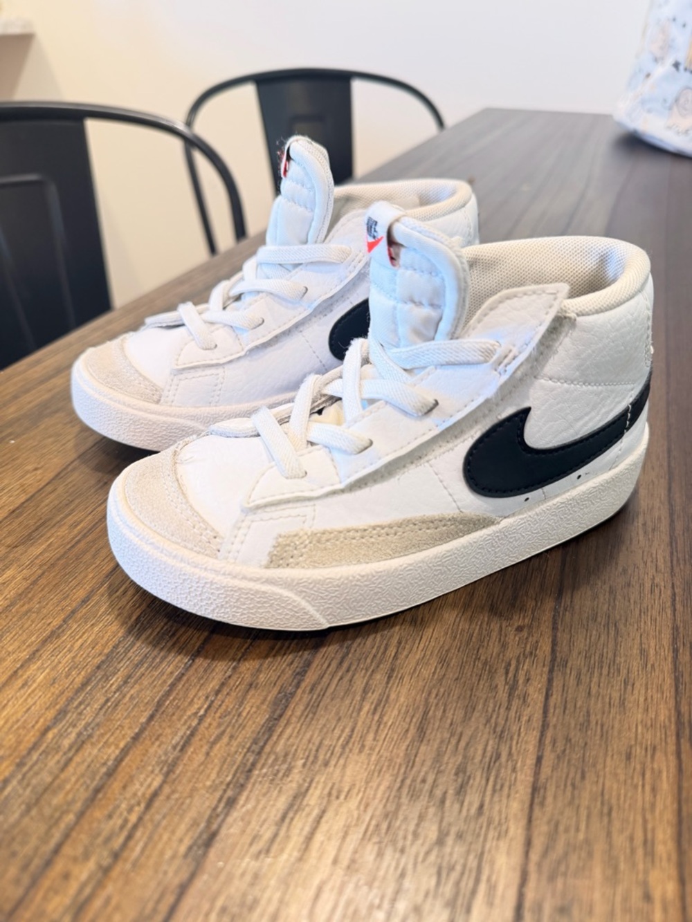 Nike Toddler White High-Top Sneakers with Black Swoosh